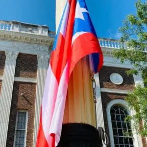 Puerto Rican flag flying on a pole.