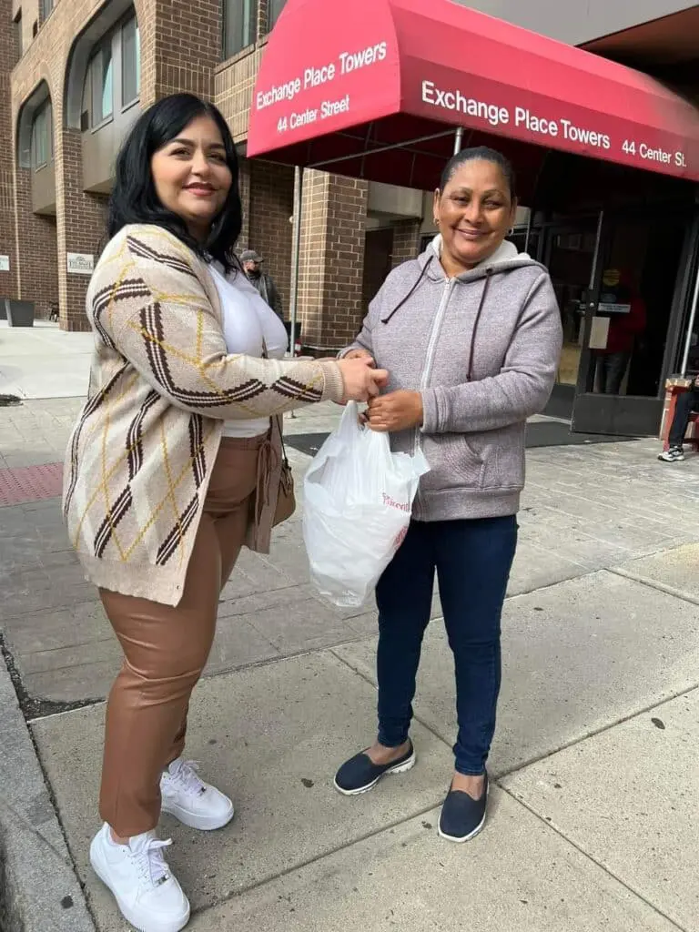 Two women standing outside Exchange Place Towers.