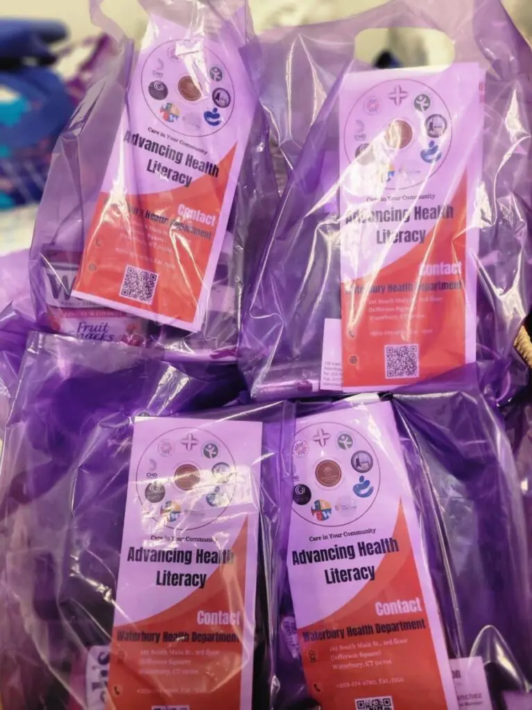 A bunch of purple bags filled with books