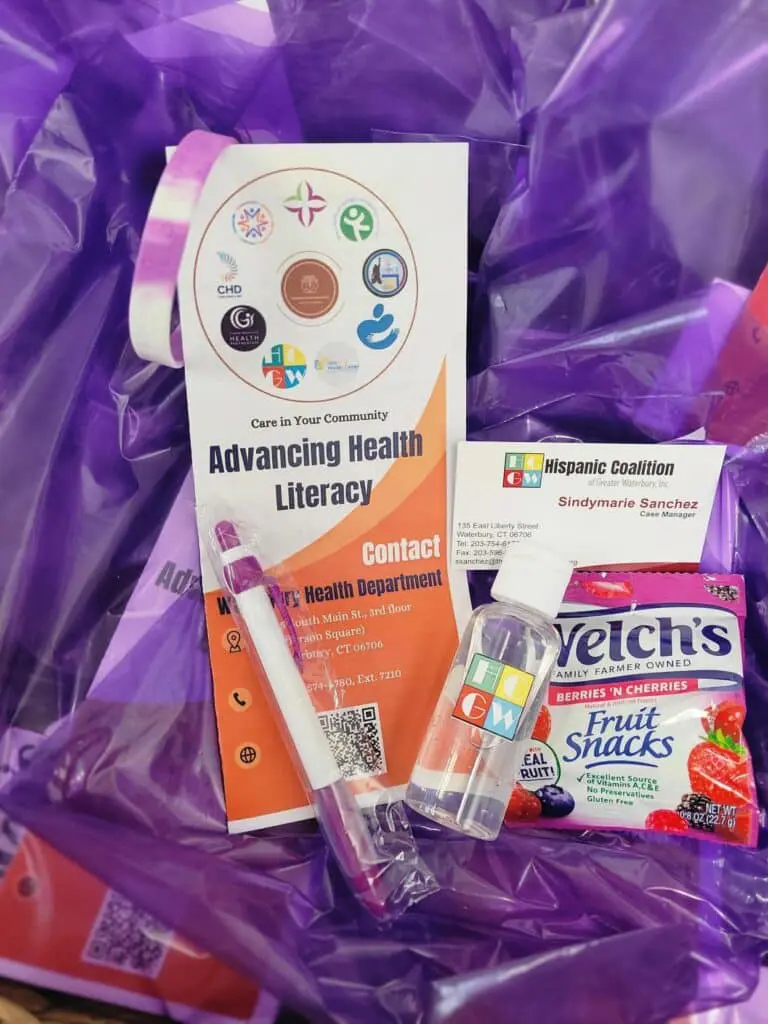 A purple bag with some items on it