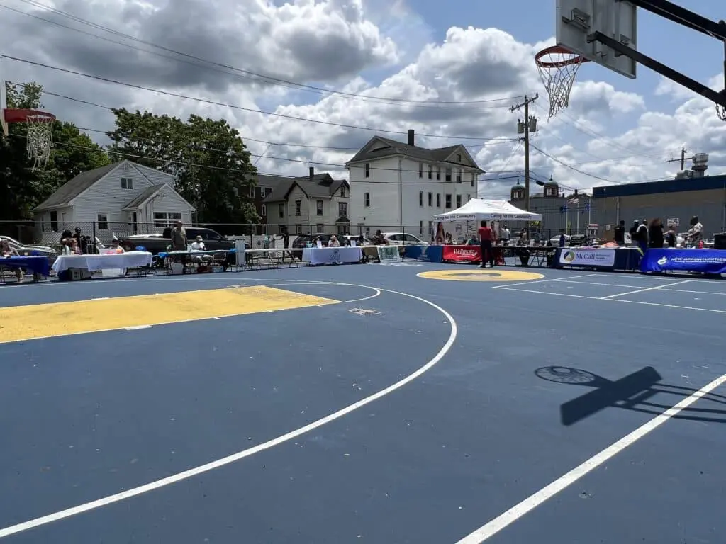 A basketball court with many people on it