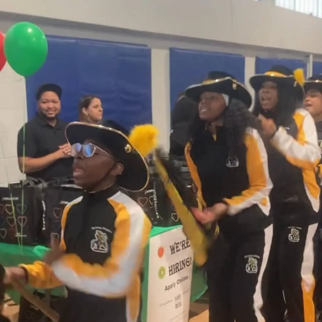 A group of people in costumes are standing around.