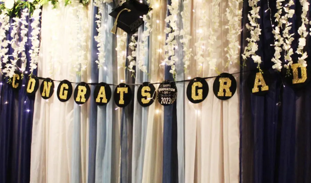 A graduation banner hanging from the side of a wall.