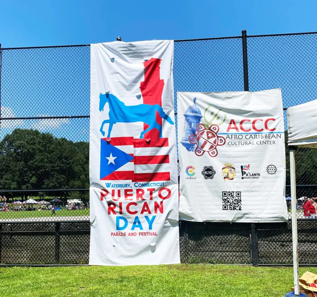 A banner that says puerto rican day and accc.