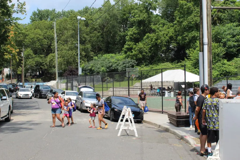 A group of people walking down the street.