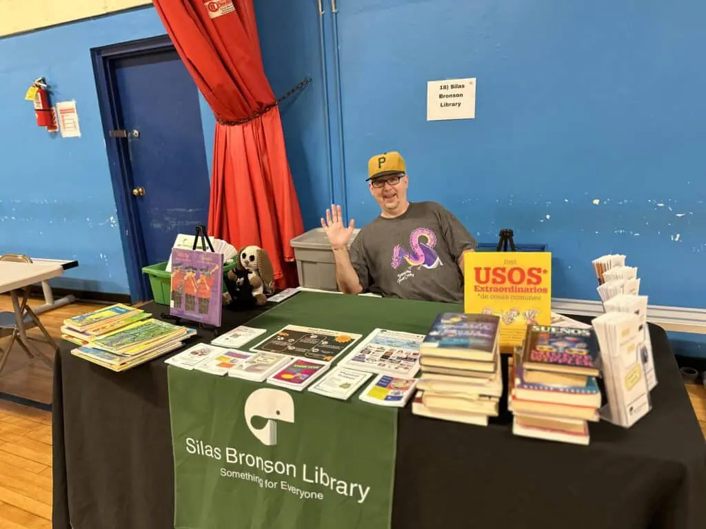 A man sitting at the table of books