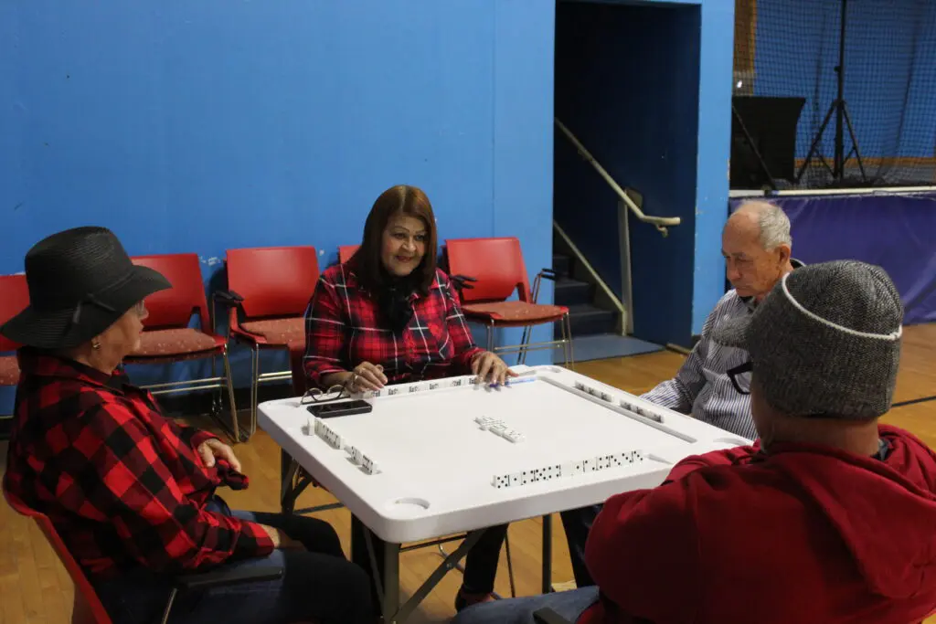 A group of people sitting around a table.