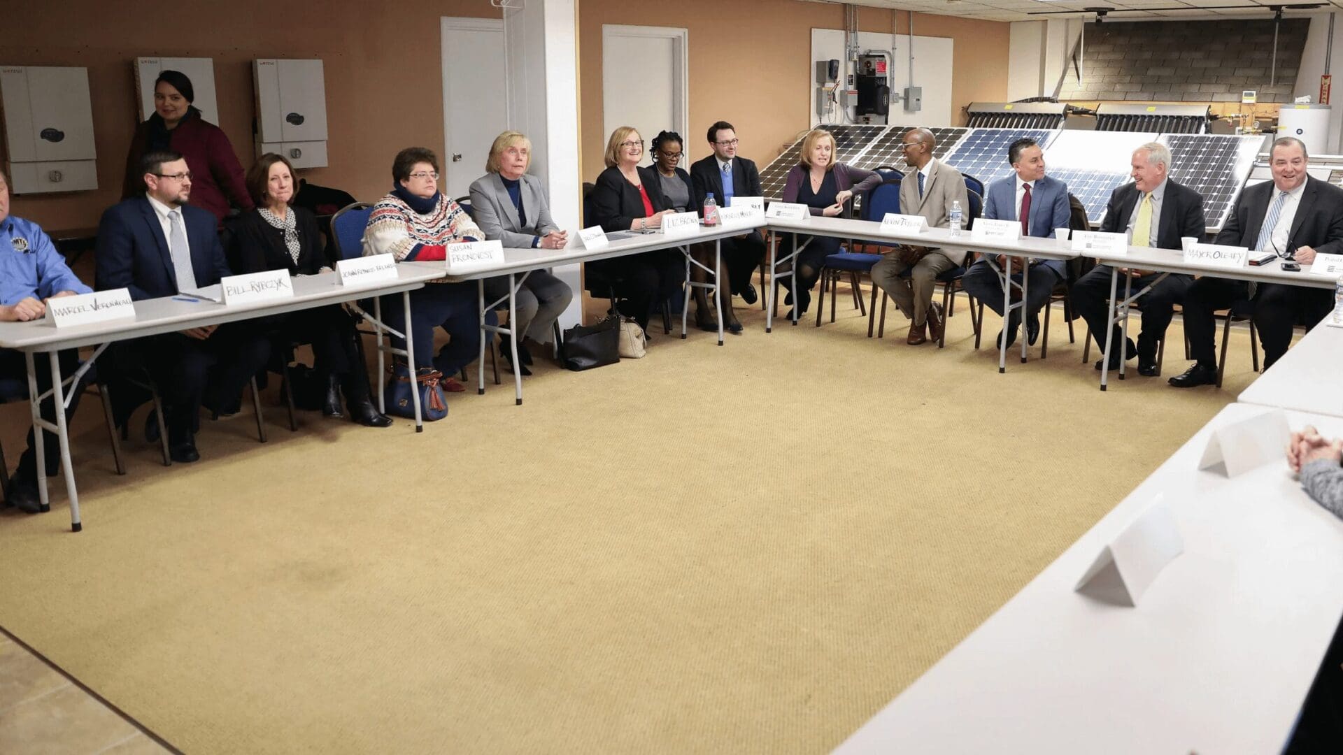 Group of people at a meeting table.