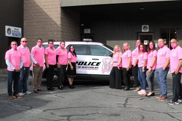 Police officers wearing pink for breast cancer awareness.