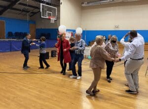 People dance at a birthday party.