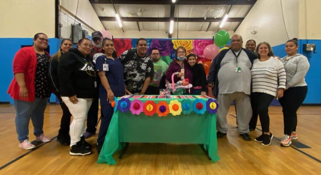 Group of people celebrating with decorations.