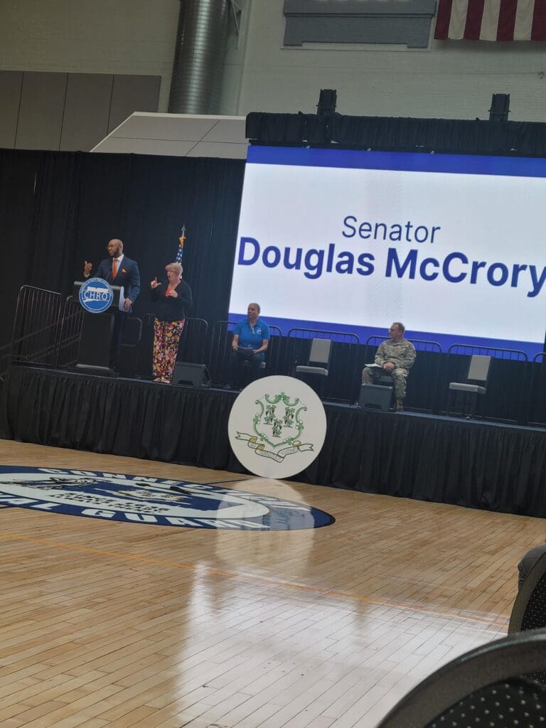 A stage with speakers and a podium in the background.