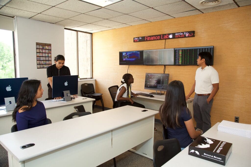 A group of people in an office setting.