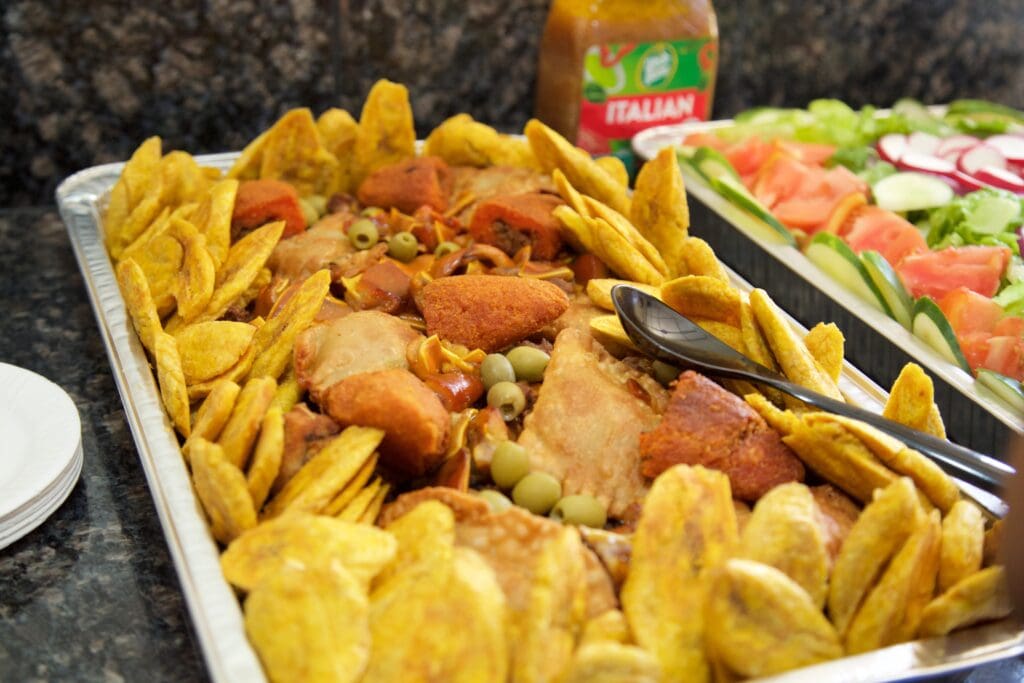 A tray of food with some meat and vegetables