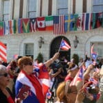 A crowd of people standing in front of a building.