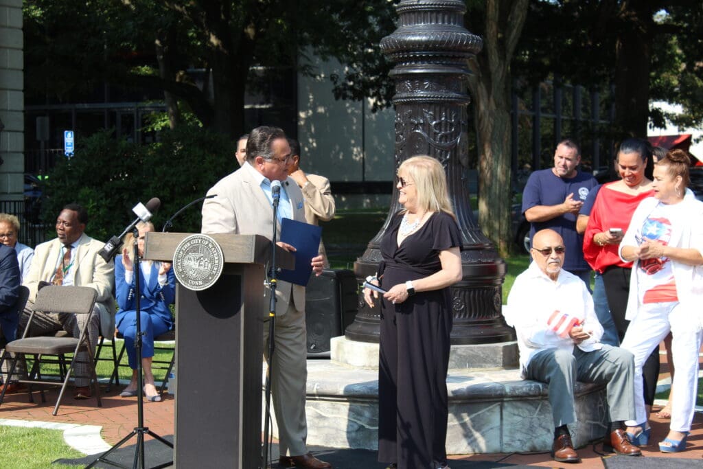 A man and woman standing at the podium