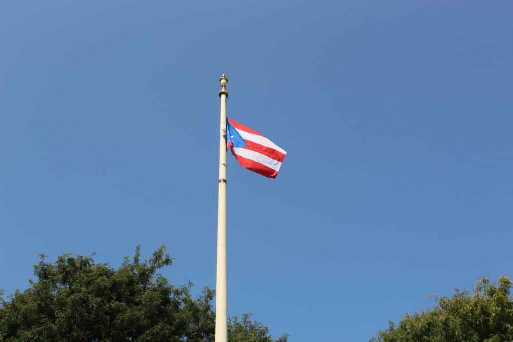 A flag flying on top of a pole.